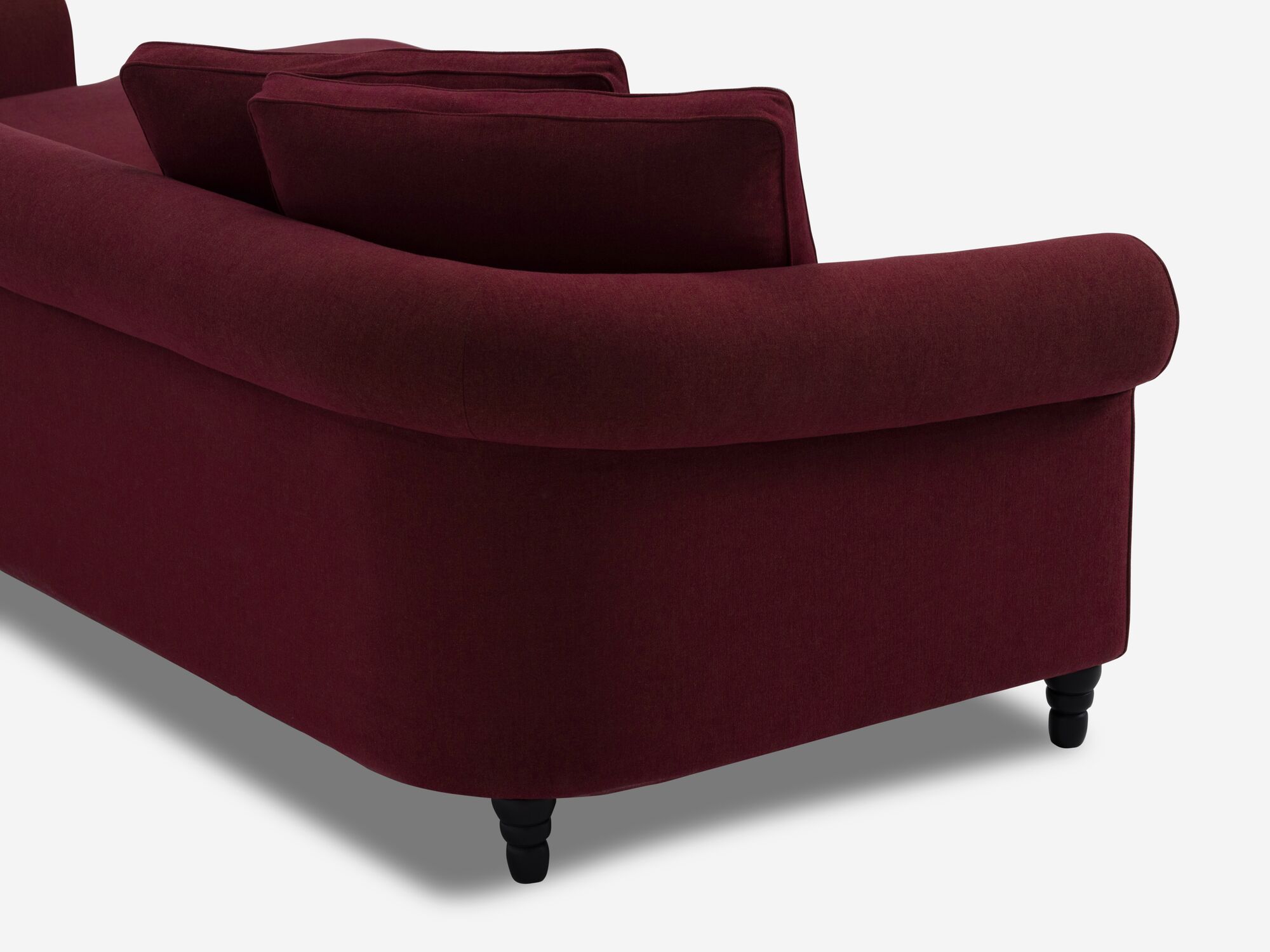 Deep red modern sectional sofa back corner detail view